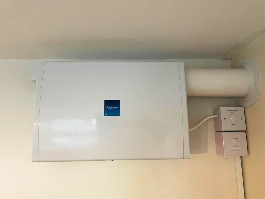 piv-unit-installed PIV Unit installed on wall with outlet leading outside.